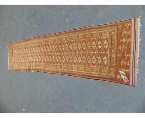 A TEKKE BOKHARA RUNNER.&nbsp; 306 x 75cms.