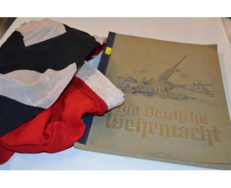 A German WW2 style NSDAP Party flag with German Army book