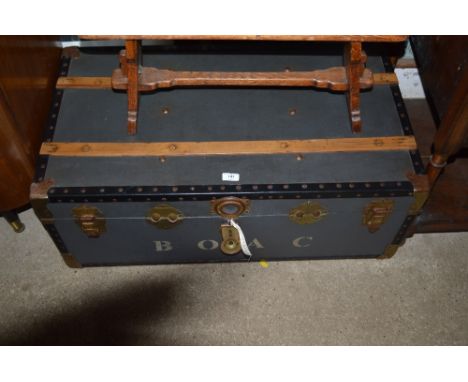 A wooden and metal bound travelling trunk 