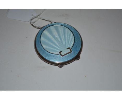 An Art Deco silver and blue enamel decorated compact 