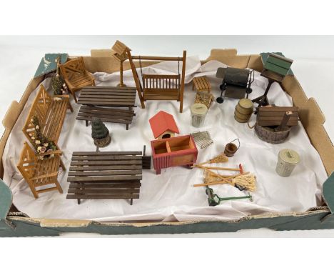 A collection of 1:12 scale dolls house garden furniture and accessories to include: dustbins, benches, tables, BBQ, bird tabl