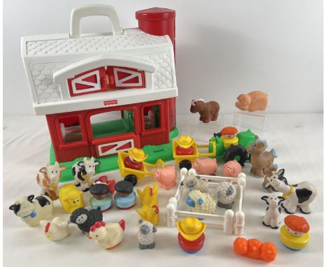A 1990's Fisher Price Little People Farm barn and play pieces. To include animals, tractor, people, trailers and fences. 