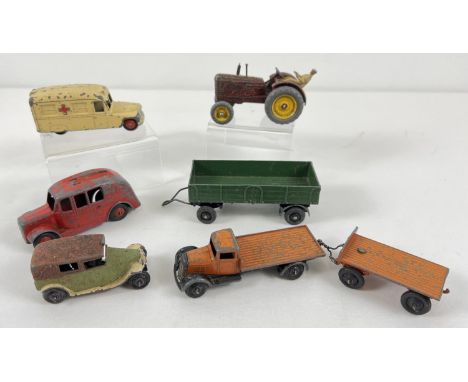 A collection of assorted vintage Dinky diecast vehicles. To include: #25c &amp; #25g flat bed truck and trailer, #27a Massey 