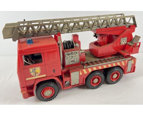 A 1:16 scale hard plastic fire engine with extending and tipping ladder by Bruder. Moving parts throughout. 