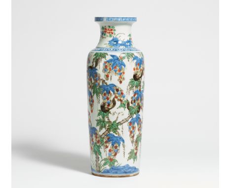 VASE WITH GRAPES AND SQUIRRELS.  China.  Porcelain, painted in underglaze blue and wucai enamel. Underneath unglazed. Cylindr