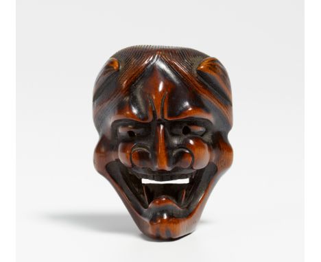 NETSUKE: HANNYA MASK.  Japan. Mid 19th c.  Wood, carved and partly dark colored. H.5.2cm. Condition A/B.  Provenance:  Former