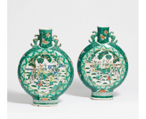 A PAIR OF MOON FLASKS WITH SCHOLARS.  China. Before 1900.  Heavy porcelain painted in famille verte. The round vase body with