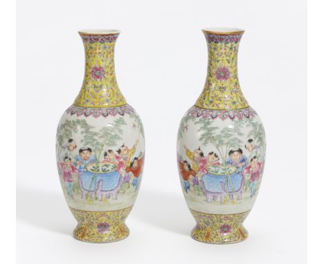 A PAIR OF VASES WITH PLAYING BOYS.  China. Republic period (1912-1949).  Thin-walled porcelain, painted in famille rose. At t