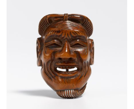 NETSUKE: MASK OF AN OLD MAN (KOJO).  Japan. 19th c.  Wood, carved. H.4.5cm. Sign.: 89 years old Tadaura. Condition B.  Proven