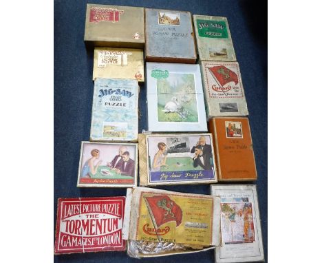 A COLLECTION OF VINTAGE EARLY 20TH CENTURY JIG SAWS to include; Chad Valley "Aquitania", GWR jig saws and others similar