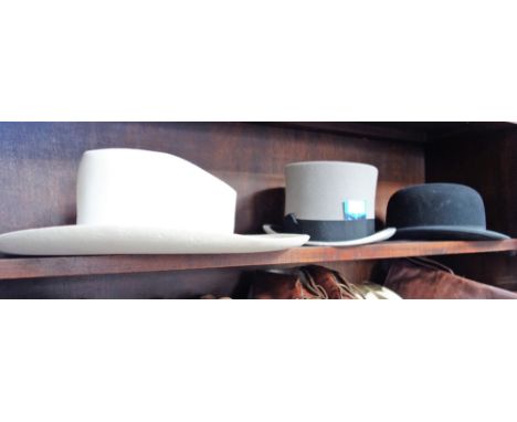 DUNN & CO: A MEN'S VINTAGE GREY TOP HAT, a black bowler hat by Austin Reed and a Stetson by 'John B Stetson Co Canada', and o