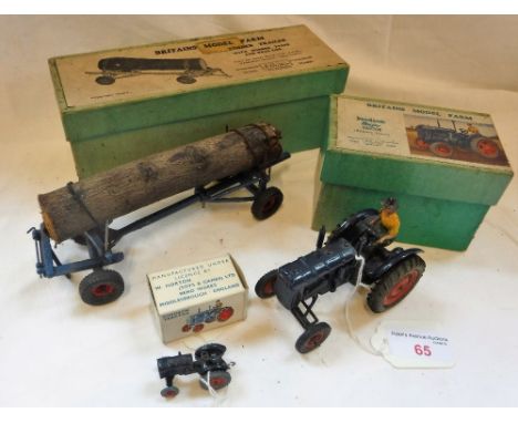 BRITAINS MODEL FARM; A FORDSON MAJOR TRACTOR a Timber Trailer (No 129F) and a Lilliput World Fordson Tractor, all with origin