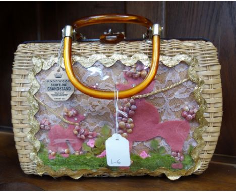 A VINTAGE WOVEN BASKET HANDBAG, the front panel with perspex insert depicting 2 felt and shell poodles, made by 'Princess Cha