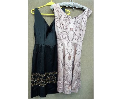 A 1960'S SATIN SLEEVELESS EVENING DRESS, the bodice a cross-over style falling to a straight skirt decorated with brown and c