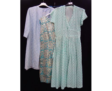 A VINTAGE 1960'S "LACE" OVER PALE BLUE SATIN COAT WITH SKIRT, a sleeveless dress of similar Vintage and a green dress (3) 