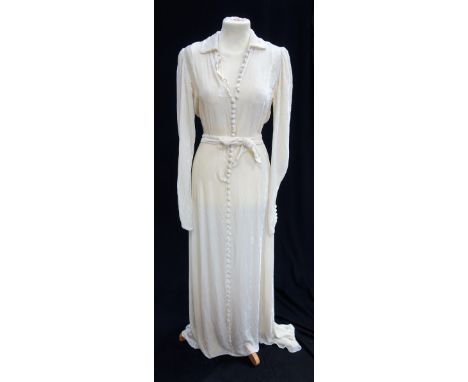 A VINTAGE CREAM VELVET LADIES DRESS, with many buttons to the front