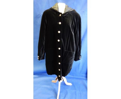 THREE QUARTER LENGTH PARKER STYLE BLACK VELVET COAT with hood with button-through detail, the buttons fashioned in gold metal