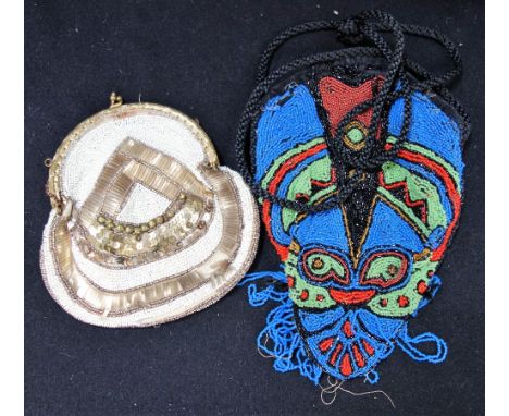 A VINTAGE PURSE DECORATED THROUGHOUT with gold and cream bugle beads and another similar decorated in blue, green and red bea