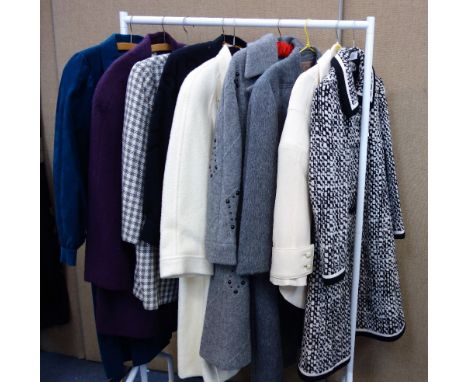 A LADIES BLACK AND WHITE COAT, by "The White House" New Bond Street and a collection of similar coats