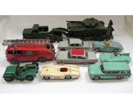 DINKY TOYS; AN AUSTIN A105, a Sunbeam Alpine, a Fire engine, a Supertoys Tank transporter with Centurion tank and similar mod
