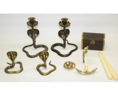 C20th pair of Indo-Persian brass candlesticks in the form of cobras, similar pair of cobra ornaments, brass anchor and money 