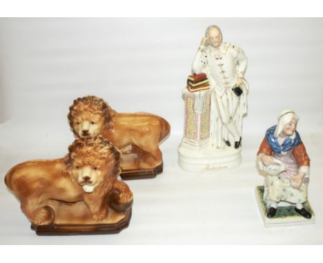 Pair of early C20th Staffordshire pottery fireside lions with paws resting on balls, glass eyes, H28cm, a large Staffordshire