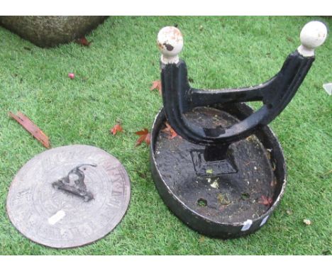 Cast metal boot scraper and lead sundial with Roman numerals (2) 