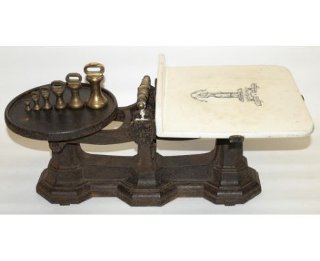 Set of vintage cast iron shop scales by Day and Millward, with white ceramic plate and brass weights, L60cm 
