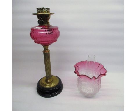 Late Victorian paraffin oil lamp, with cranberry coloured reservoir, cranberry tinted acid etched shade on brass Corinthian f