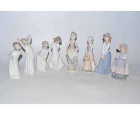 Three Lladro ceramic figures, five Nao ceramic figures (8) 