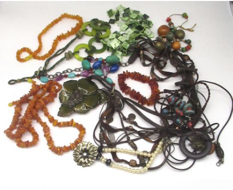 Collection of costume jewellery including amber necklaces, handmade enamel floral necklace, beaded necklaces etc. 