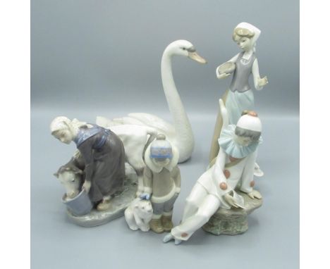 Royal Copenhagen figure of a woman feeding a cow, printed marks, 3 Lladro figures and a Nao figure (5) 