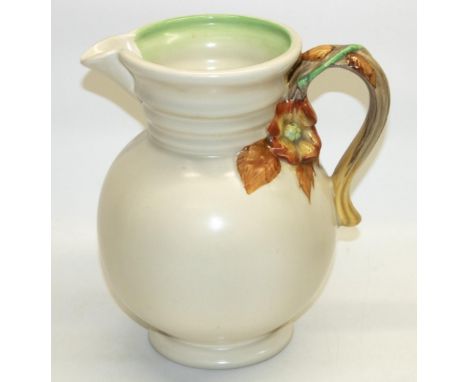 Clarice Cliff, Newport Pottery "My Garden" jug, cream glaze with autumnal coloured handle, relief moulded makers mark and pat