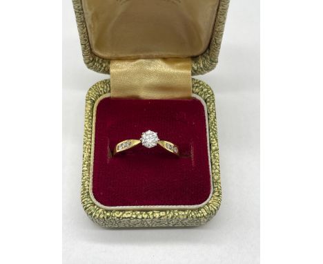 18ct yellow gold diamond solitaire ring with diamond set shoulders, stamped 750, size M, 2.9g 