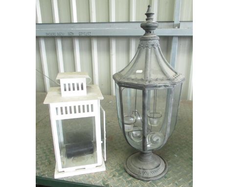 Modern metal and glass candle lantern, and a white enamel candle lantern, H45cm (2) 