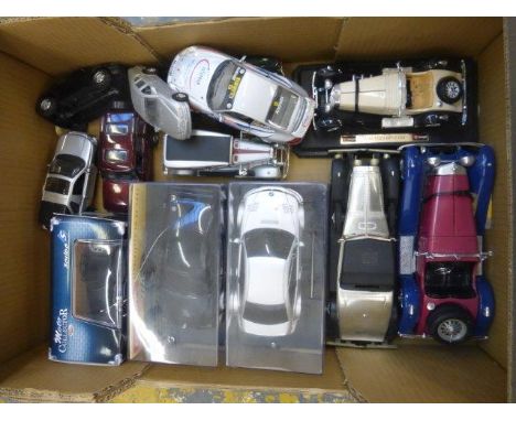 A box of assorted model cars 1/24 scale, including Burago and battery operated cars.