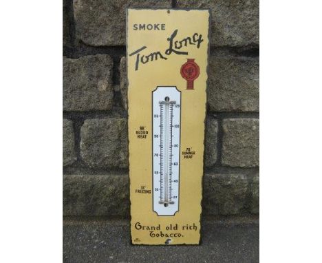 A Tom Long Tobacco enamel thermometer, 7 1/2 x 22 1/2".