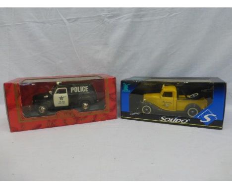 A boxed Mira E/1:18 Chevy Panel Truck 1950 and a boxed Solido Ford Depanneuse.
