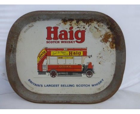 A Haig Scotch Whisky pictorial tin tray with design depicting an early bus, 16 1/2 x 12 3/4".