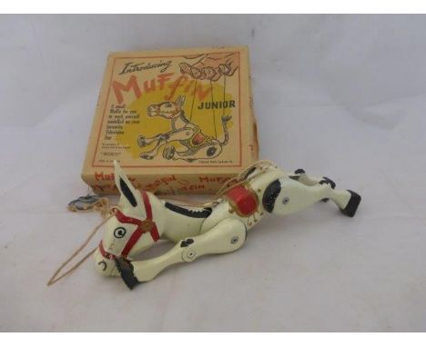 A boxed Muffin Junior tinplate puppet. 