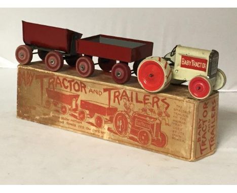 An early and rare boxed Animate Toy tinplate 'Baby Tractor and Trailers'.