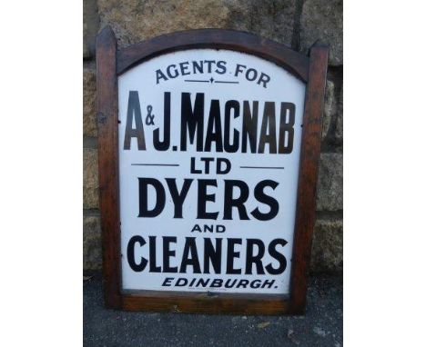 An enamel agency sign for A&J Macnab Limited Dyers and Cleaners, Edinburgh by Patent Enamel, set within a wooden frame, 16 1/