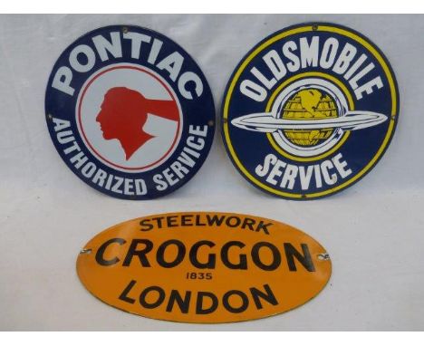 Two circular reproduction American enamel signs relating to Pontiac and Oldsmobile.