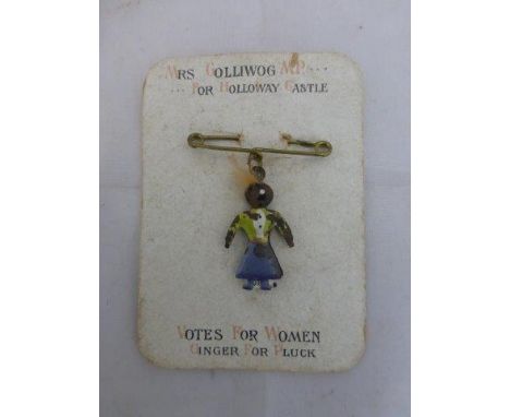 An extremely rare Golly pin on original cardboard mount labelled 'Mrs Golliwog MP for Holloway Castle; Votes for Women; Ginge