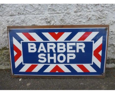A decorative 'Barber Shop' rectangular enamel sign, 18 x 9".