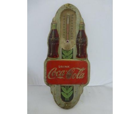 A Coca-Cola embossed tin thermometer sign, 7 x 16". 