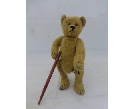 A rare Bing clockwork bear circa 1916-1920s, filled with wood wool, black boot button eyes with a hump on his back, metal tag