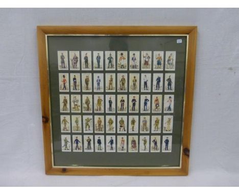 A framed and glazed set of reproduction John Player and Sons - uniforms of the Territorial Army.