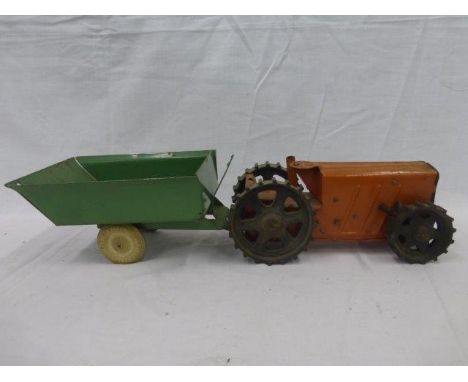 A Triang Tractor no. 2 and a Triang Toys tinplate tipping trailer.