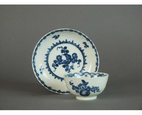 A Caughley 'Fruit and Wreath' tea bowl and saucer circa 1778-88 transfer-printed in underglaze blue with a large fruit within